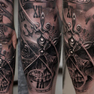 balck-and-grey-skull-dagger-clock-tattoo