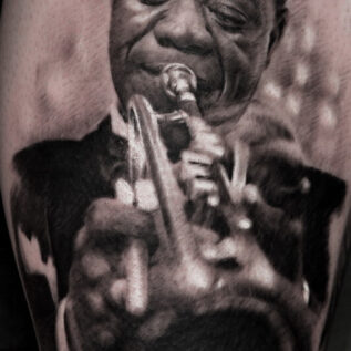 black-and-grey-louis-armstrong-portrait-tattoo